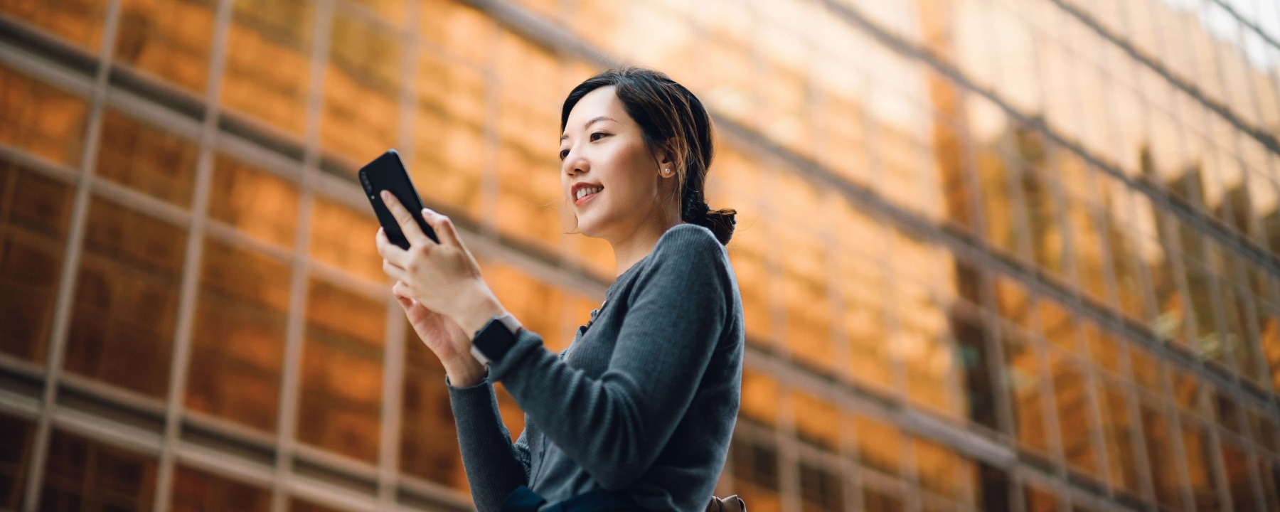 Telecom - Women browsing mobile phone