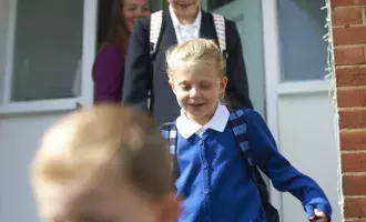 School children leaving the house