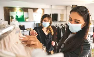 Women shopping wearing masks