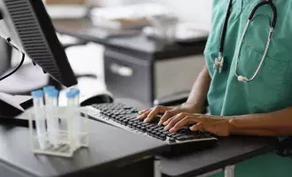 capita-photography-stock-original-getty620924951-mixed-race-nurse-working-at-computer.jpg