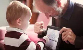 Local government - child and older person using tablet - 800x600