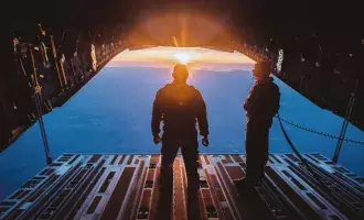 RAF plane with sunset