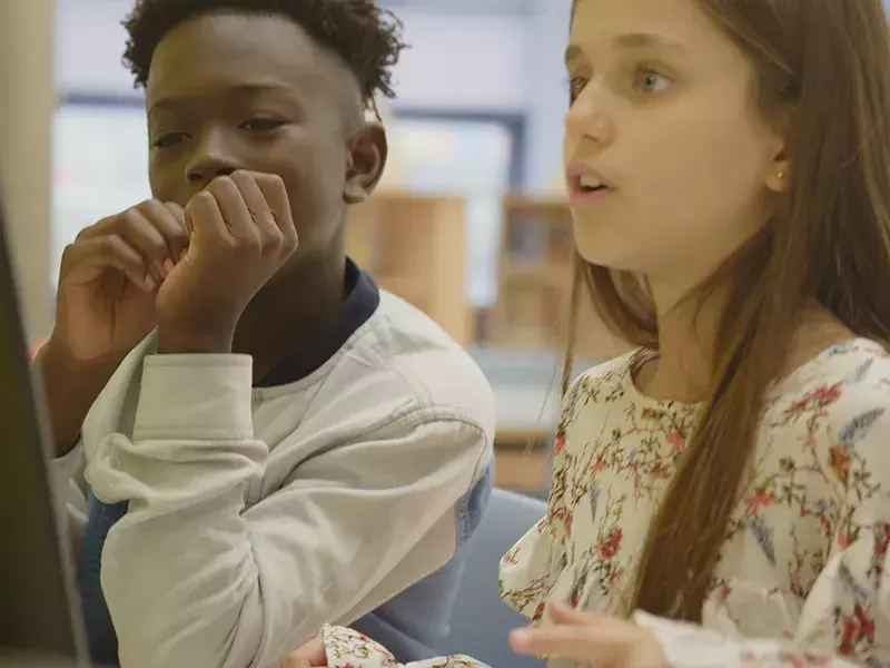 2 children in a classroom