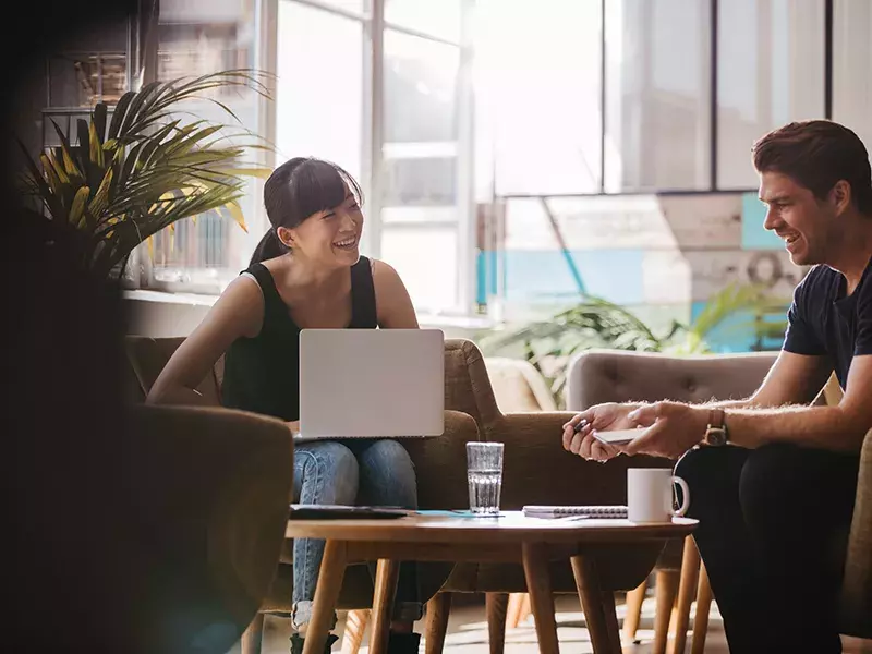 people remote working in a coffee shop
