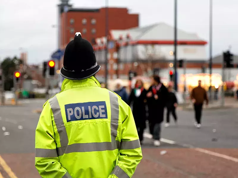 A police officer looking ahead