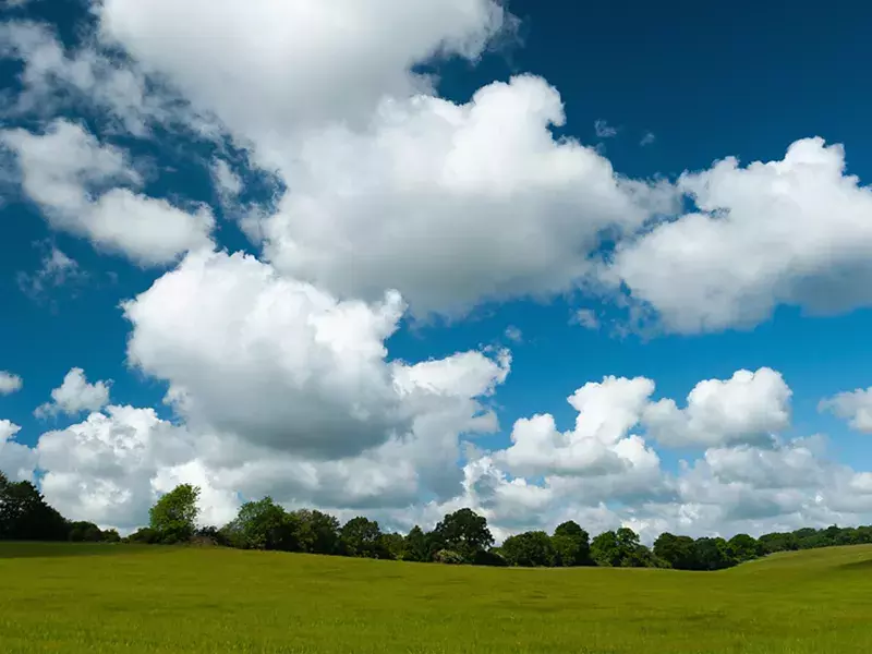 Clouds in sky above fields