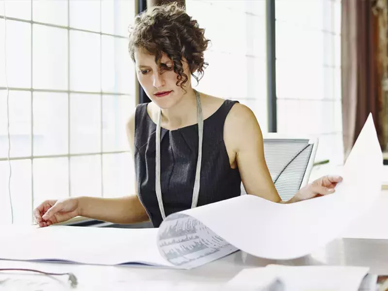 female professional looking in documents