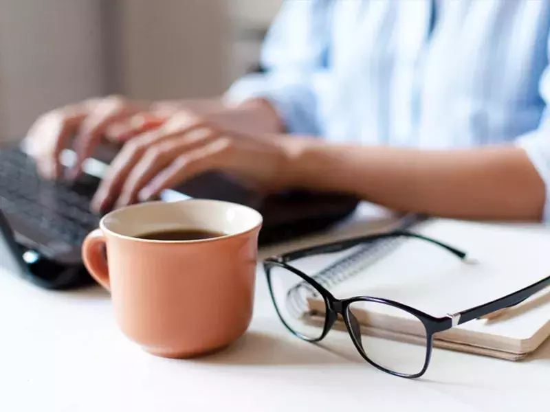 Remote worker typing on laptop