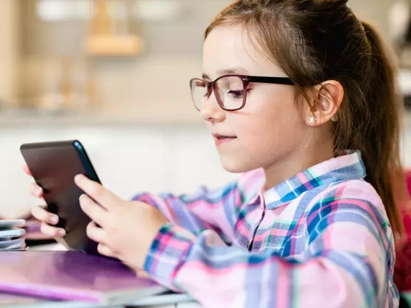 Girl student looking at phone
