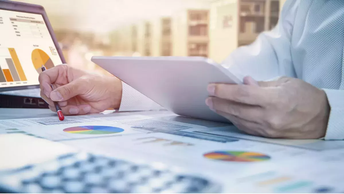 Holding tablet while looking at graphs