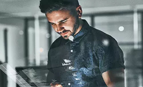 Man looking at a tablet device