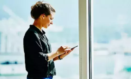 Women interacting with tablet device