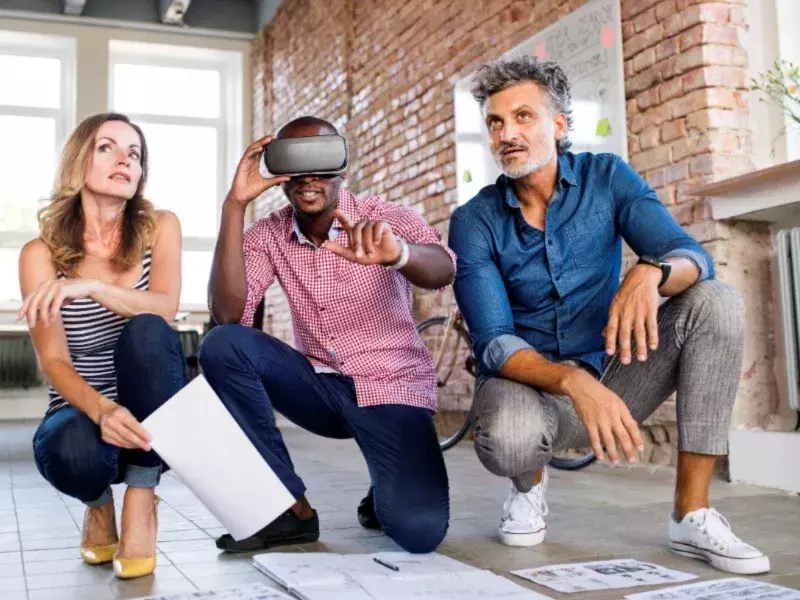 Team of architects discussing the rebuilding of a loft office