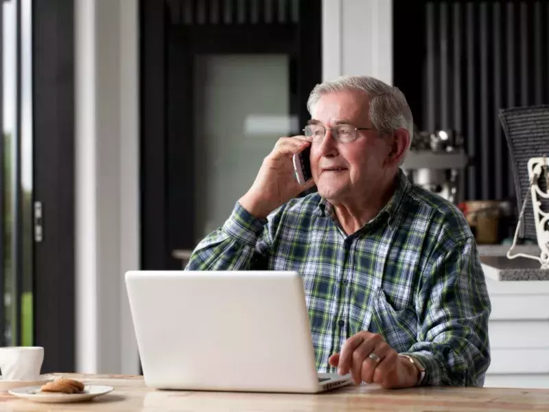 Old man talking on phone