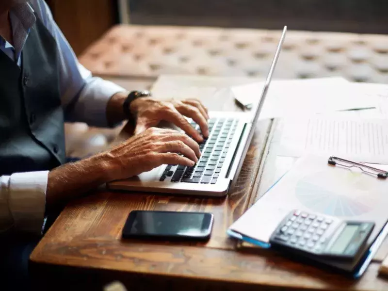 using laptop and calculator