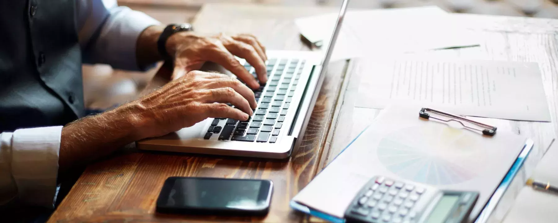 using laptop and calculator