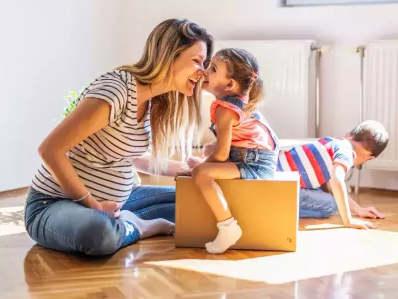 Financial Services - women playing with kids