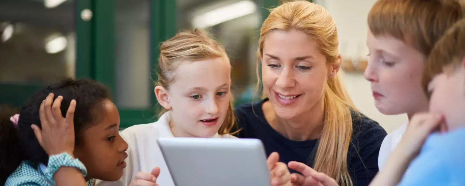Education-Teacher with students using tablet