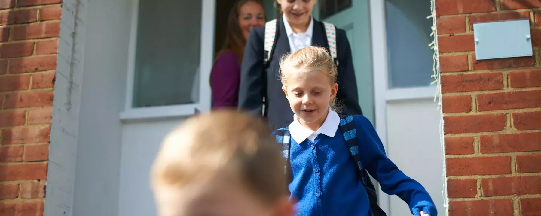 School kids leaving house