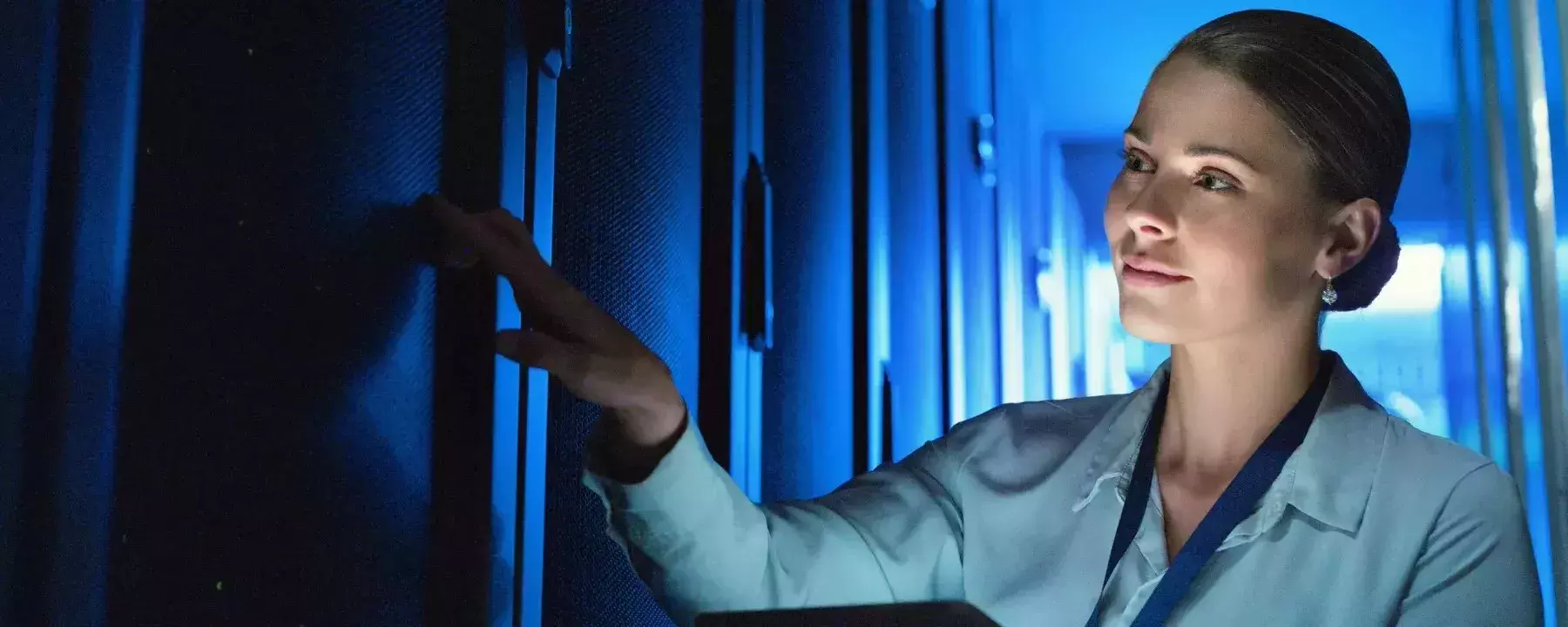 Tablet, woman and technician working in server room