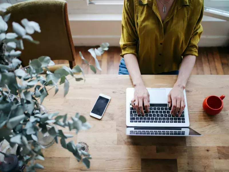 lady typing on laptop