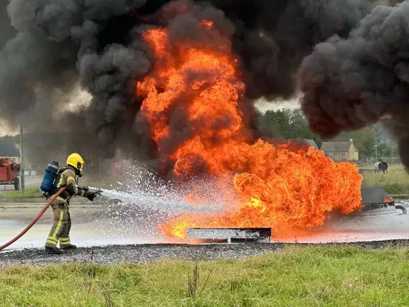 Defence Firefighter extinguishing an industrial fire