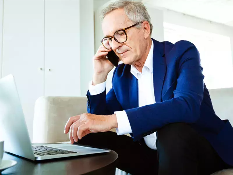Investment consulting business man using laptop